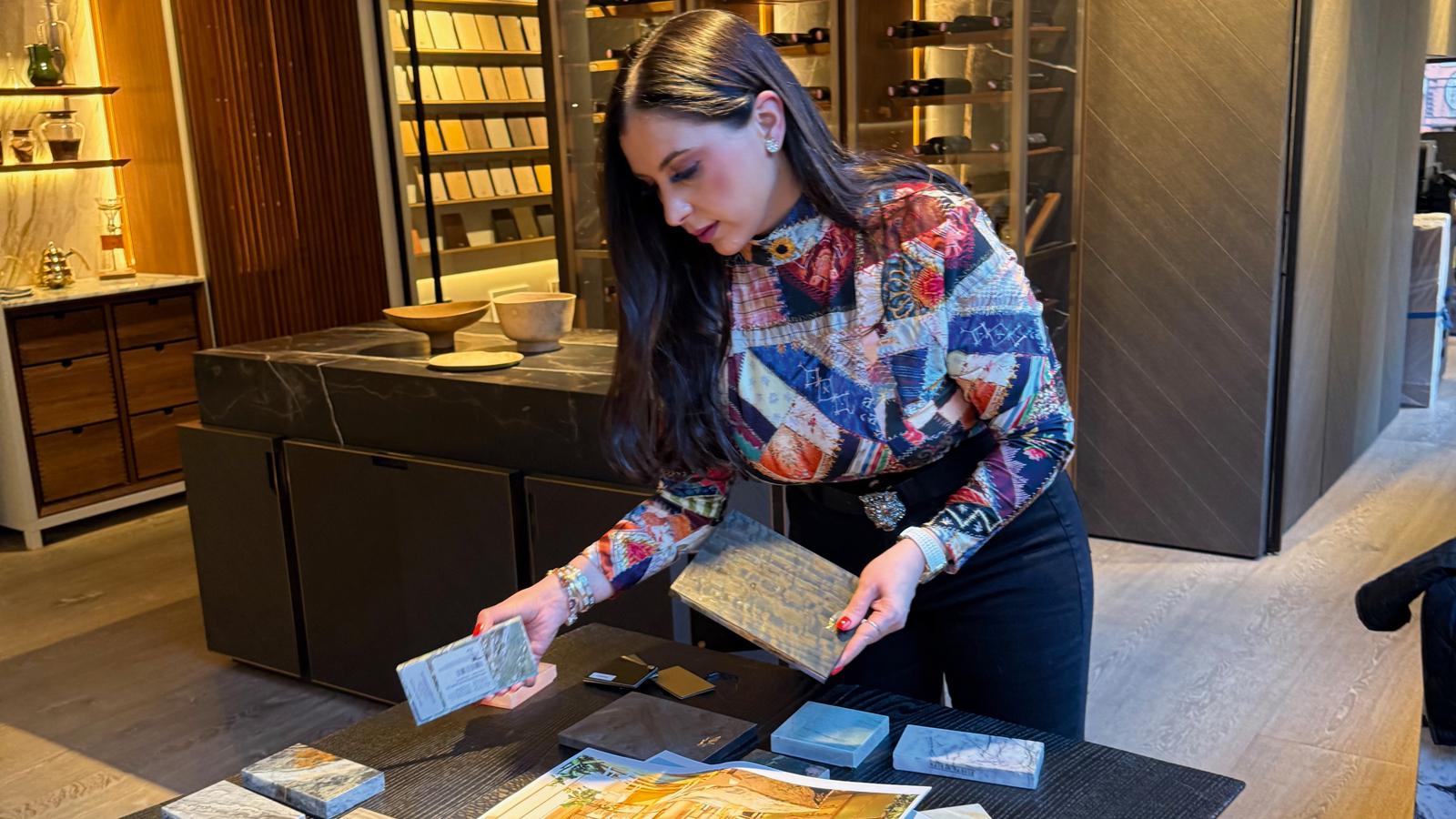 Client examining material samples in a design showroom
