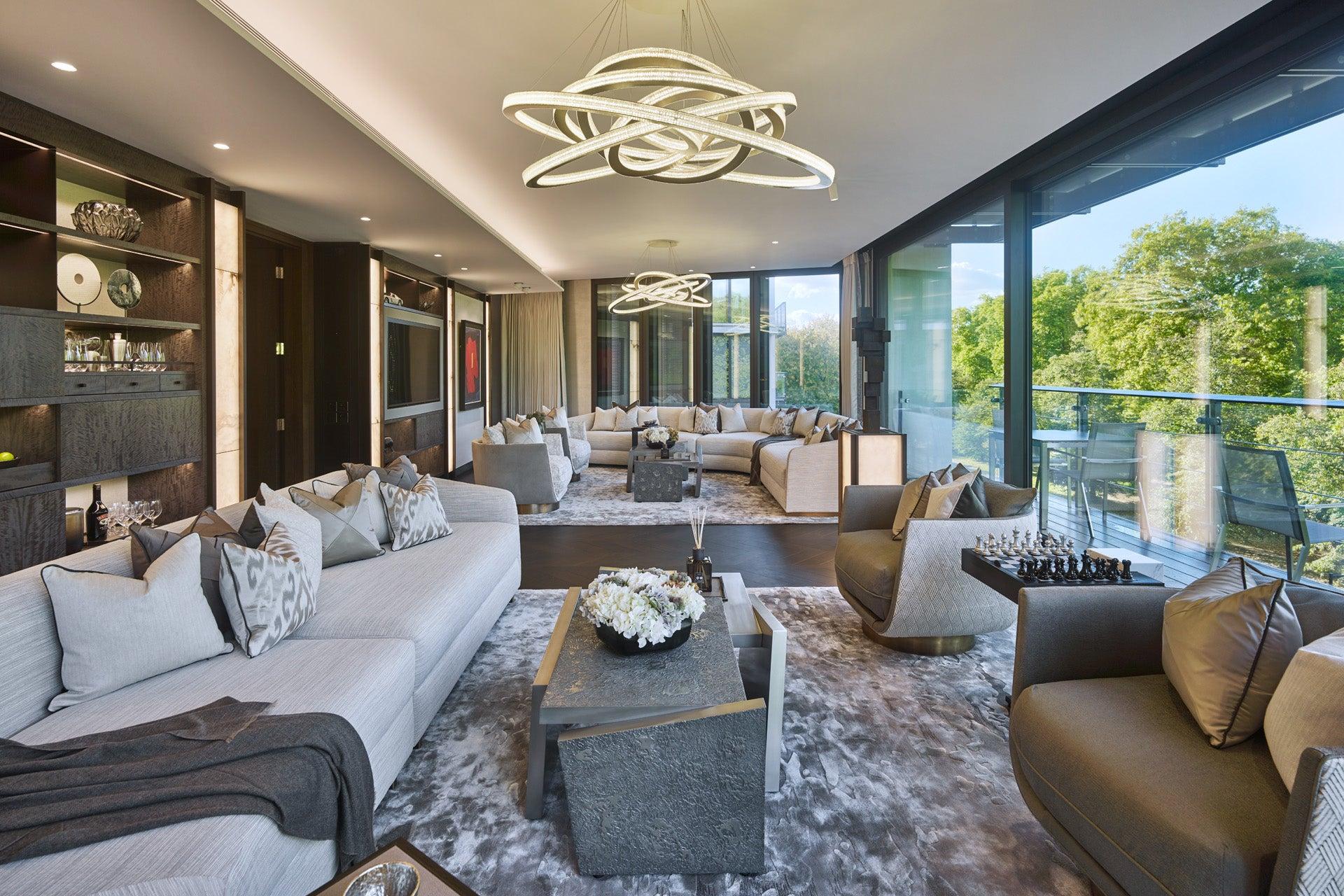 Spacious living room with large windows and garden views